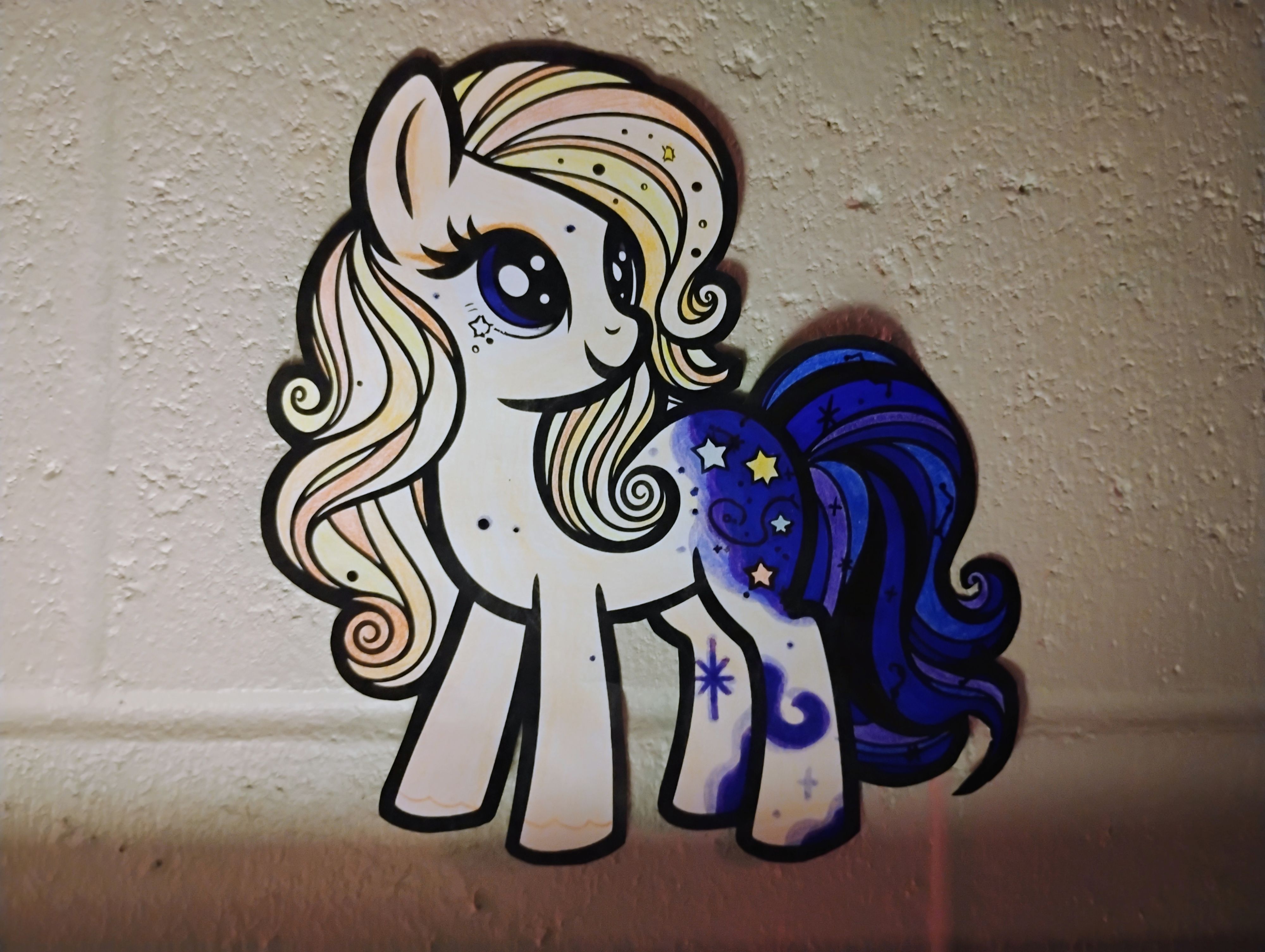 More accurate portrayal of her coat and mane design, missing her horn and wings.